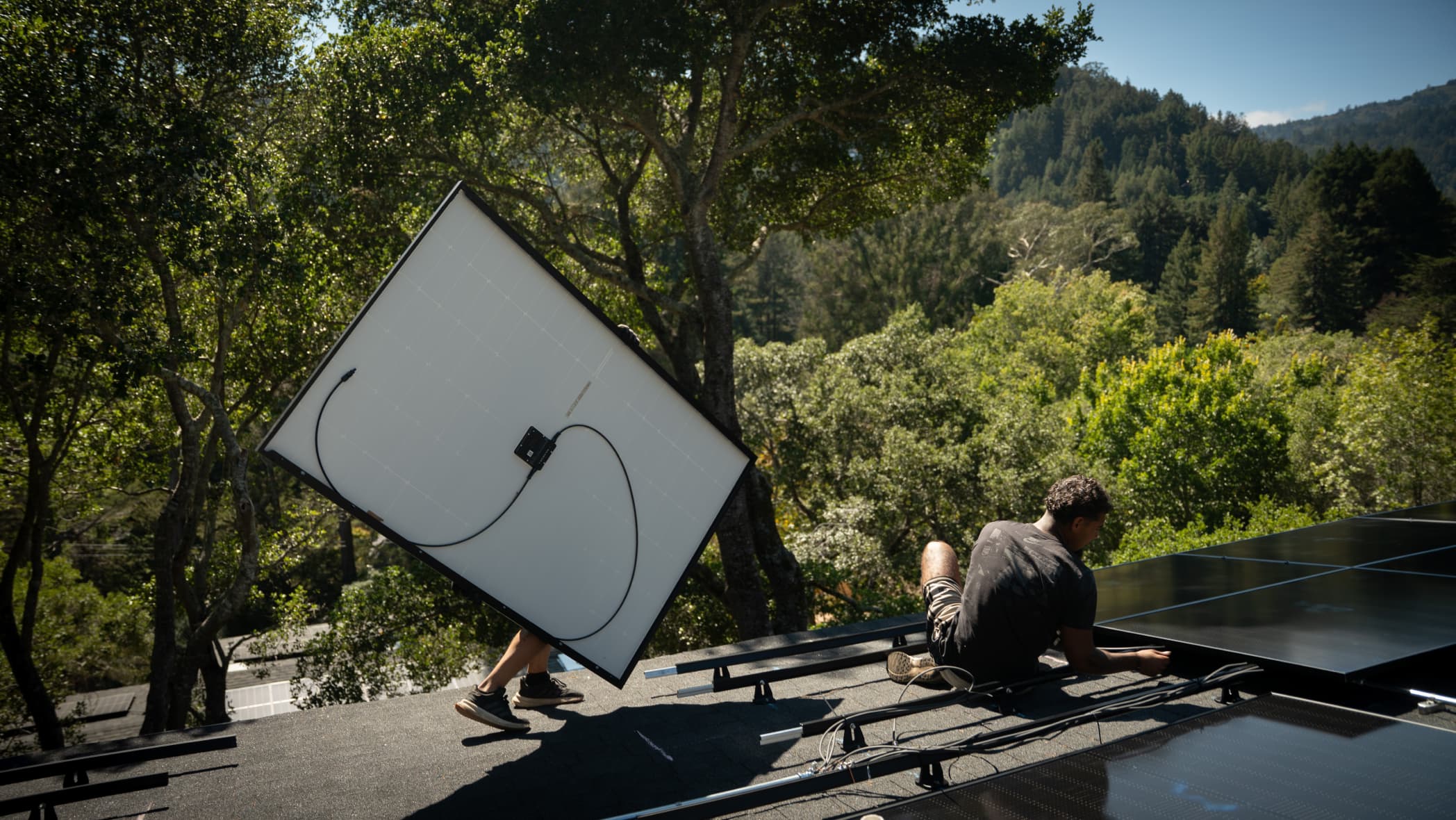 Installer working on ladder